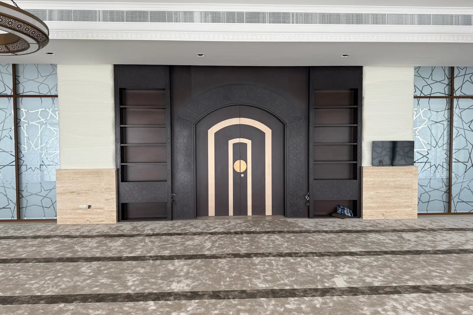 The timber entrance door set into the printed wall