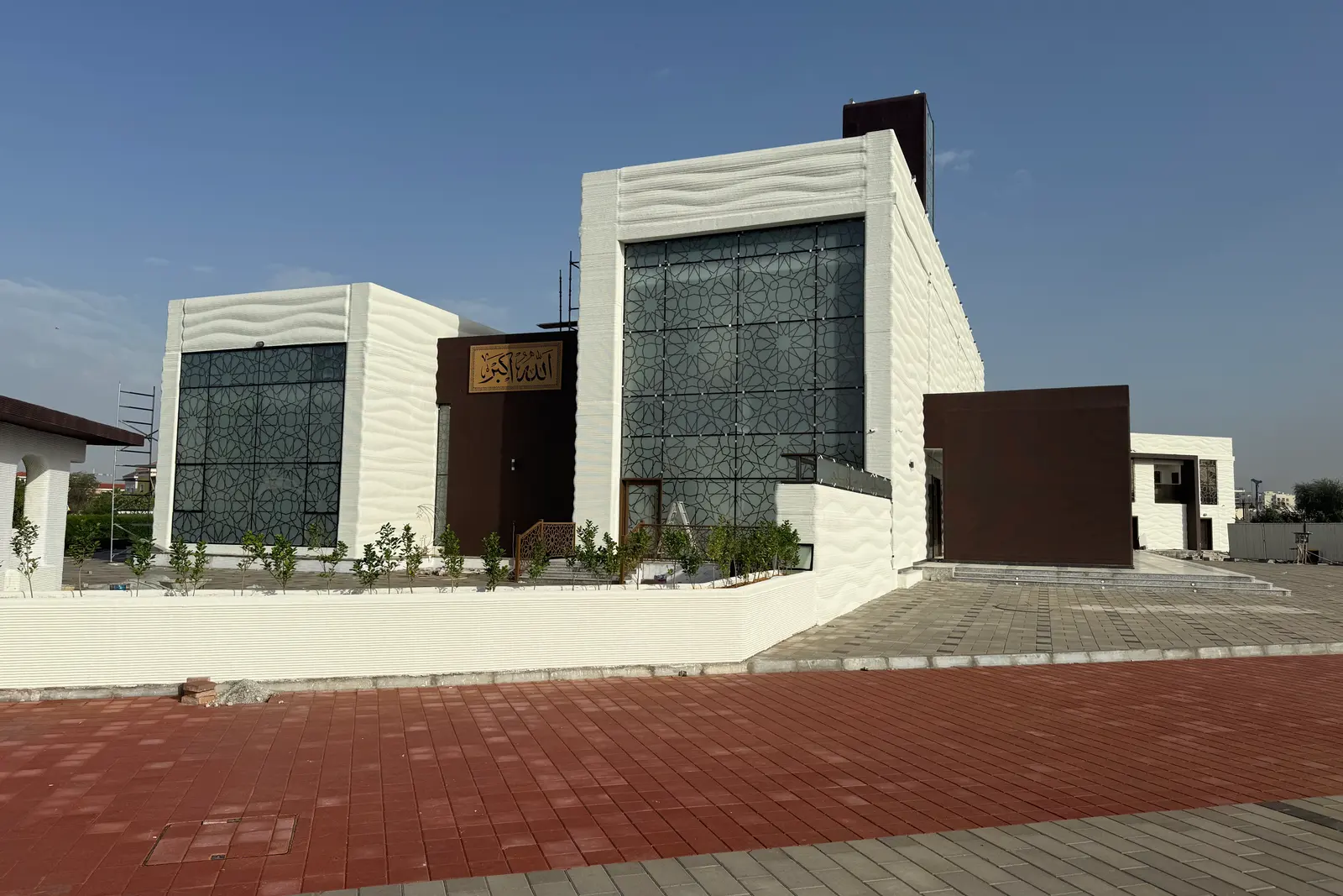 Saddiq Mosque from the side, the printed walls meeting the glazed screen