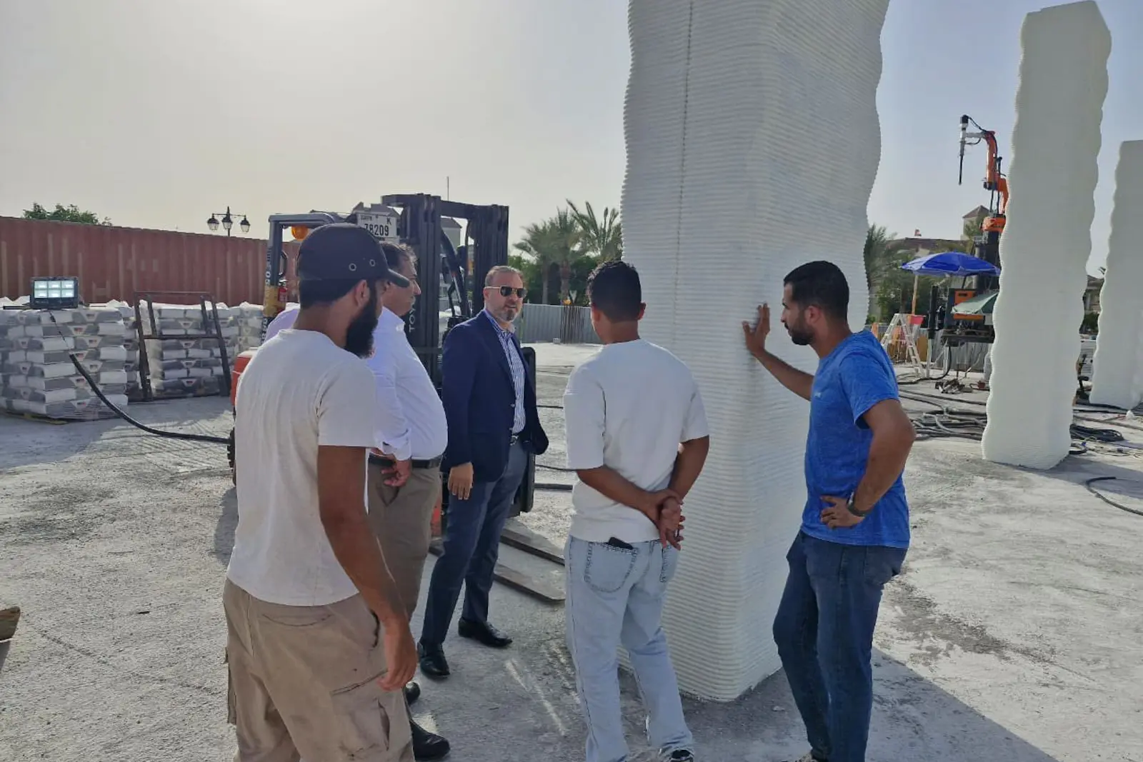 The Miles team on site alongside printed columns