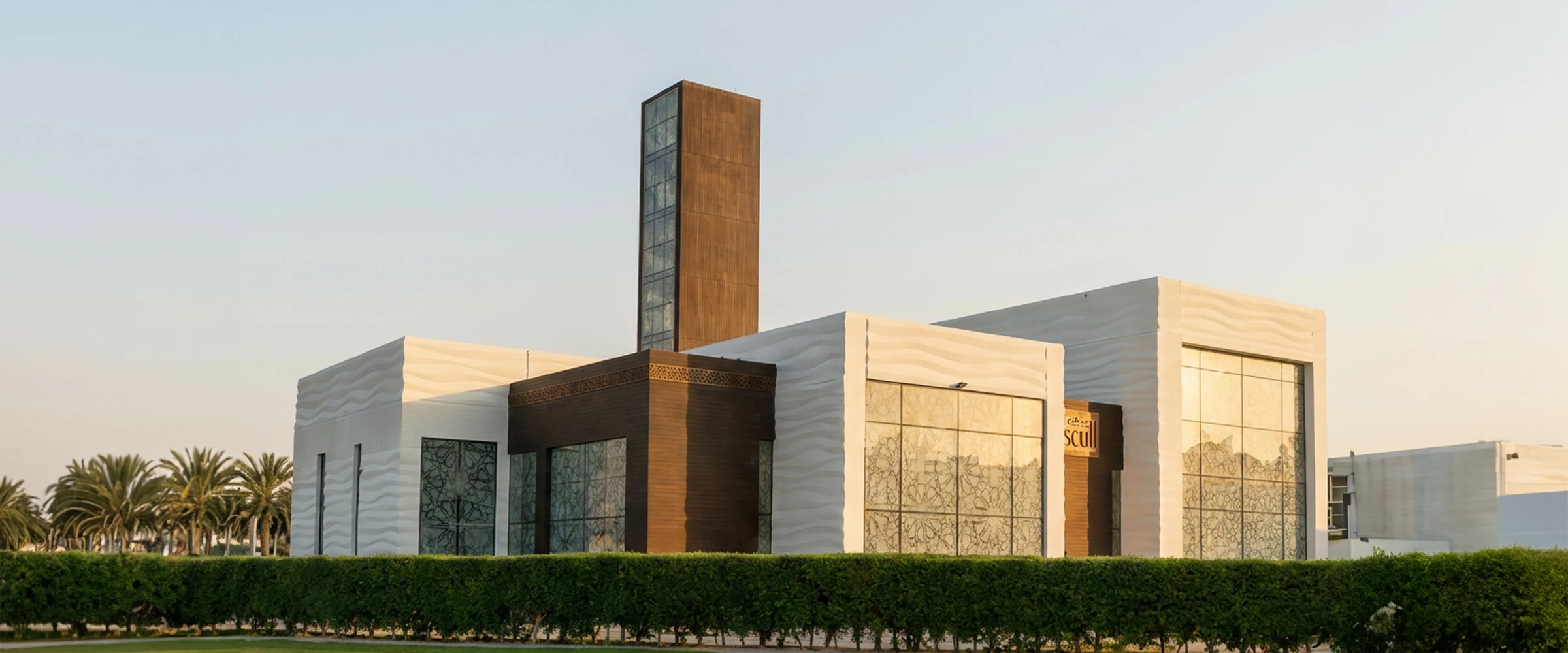 Saddiq Mosque in The Villa, Dubai — the printed wave texture across the completed facade